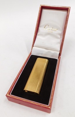 A Cartier pocket lighter, in gold coloured casing, numbered 056668, boxed. - 4