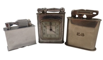 Three table lighters, comprising a Mc Murdo chrome lighter, a stainless steel Semca clock table lighter, 11cm high, and a HKW table lighter, stainless steel cased, marked E DE B, 11cm high. (3)