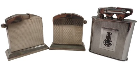 Three table lighters, comprising two Kaschie chrome lighters, one inscribed Alfred Basler, and the other with engine turned decoration, 8cm high, and a KW lighter with enamel emblem, 10cm high. (3)