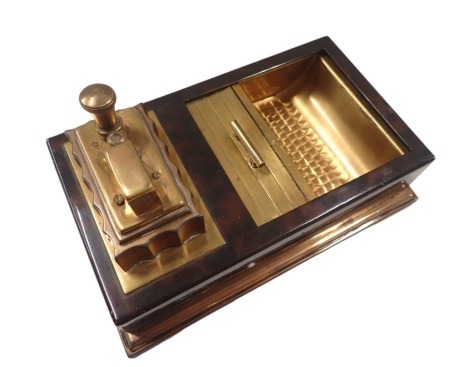 A Ronson Art Deco table lighter, in tortoiseshell style finish, with a closed section for cigars, and a brass lighter, on a stepped foot, 9.5cm high, 18cm wide, 11cm deep.