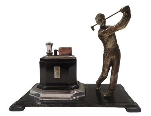 A Ronson Art Deco table lighter, formed as a male golfer, on black metal base, with chrome and black lighter, 16cm high, 19cm wide, 9cm deep.