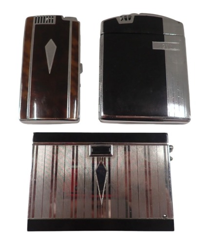 Three cigarette case table lighters, comprising an Art Deco Ronson black enamel and chrome example, a Ronson twenty case, bearing the initials GVC, and a Ronson imitation tortoiseshell finish case. (3)