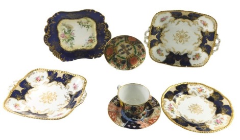 19thC ceramics, comprising an Imari trio set, three Coalport cake plates, on a Royal Blue ground with flowers and gilded border, and a cabinet plate. (7)