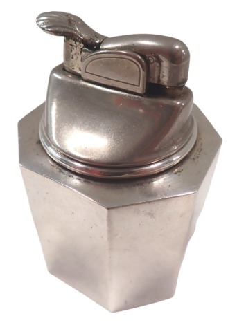 A Cartier table lighter, of octagonal form, the lighter with shell cap, stamped white metal weighted sterling, 9cm high.