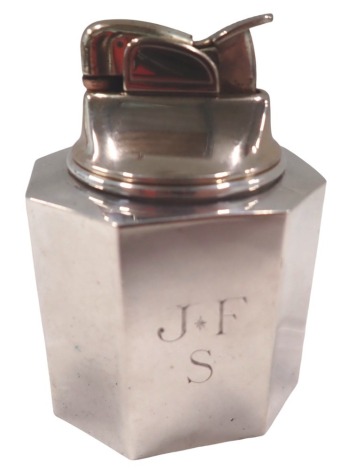 An Evans USA table lighter, of octagonal form, bearing the initials JFS, white metal stamped weighted sterling, 8cm high.