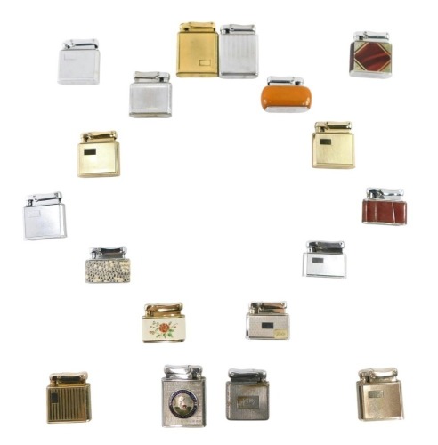 A collection of Colibre Monopol pocket lighters, to include chrome and gold coloured cased examples, an orange amber style cased example, Matrix and others, in fitted display case. (18)