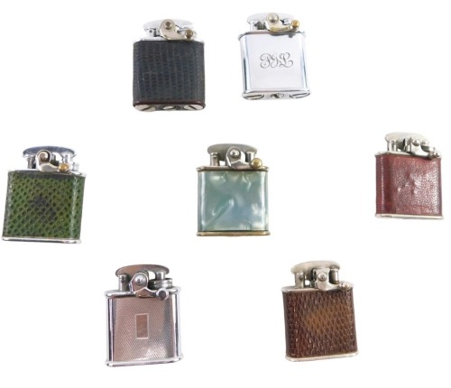 Withdrawn pre-sale. Seven Colibre pocket lighters, four leatherette cased, and another mottle decoration, in display case.