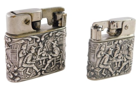 Two pocket lighters, comprising a Mylflam pocket lighter, with silver Dutch style case, of playing figures, with Continental marks, and a baby Mylflam of similar design. (2)