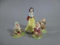 Four Royal Doulton porcelain items from Snow White and The Seven Dwarfs