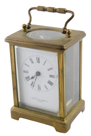 A Mappin & Webb 20thC brass cased carriage clock, with a white enamel Roman numeric dial, and black hands, stamped Paris, with a brass key wind movement, 10cm high.