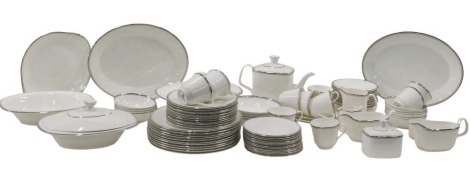 A Royal Doulton Platinum Concord part dinner service, on white ground with silvered border, comprising three tureens, two with lids, two gravy boats and saucers, milk jug, sugar bowl, a lidded sugar bowl and cover, ten teacups, small milk jug, two oval se