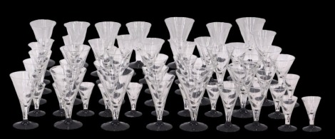 A selection of Art Deco drinking glasses, each with flared rim top, with polka dot and stripe decoration, on a blackened foot. (3 trays)