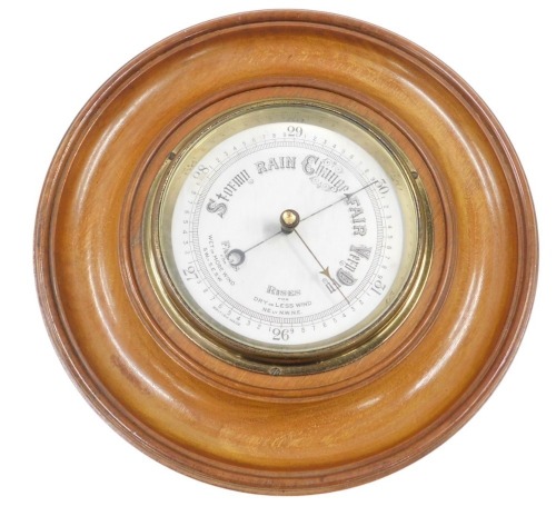 A Wilson 20thC oak cased barometer, with silver dial in brass case, with Britain's Mansfield stamped to reverse, 26cm diameter.