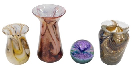 Four items of Art Glass, comprising an Adrian Sankey brown and blue swirl vase, 14cm high, bearing label, a red and pink swirl stem vase, 18cm high, yellow and brown swirl vase, 11cm high, unmarked, and a C&G purple glass paperweight.(4)