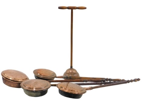 Five 19thC copper wares, comprising four copper warming pans, and a copper and turned wooden handle posher, 105cm long.