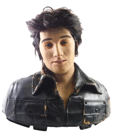 A WowWee silicon Elvis Presley animatronic bust, with sun shades and leather jacket, with Elvis pin, 50cm high, 41cm wide.