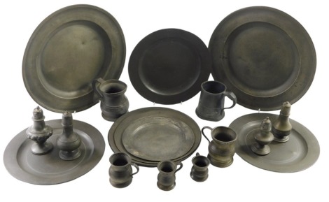 A collection of 19thC and later pewter, comprising serving plates, 30cm diameter, small serving plates, 23cm diameter, salt and pepper pots, tankards, etc. (1 tray)