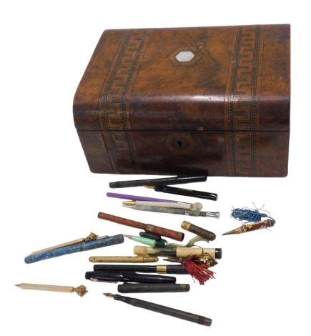 A 19thC walnut writing box, with boxwood inlay and mother of pearl top, partially fitted interior, 12cm high, 28cm wide, 21cm deep (AF), and a selection of ballpoint and fountain pens, to include golden gun, pan shine, and others. (a quantity)