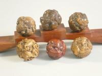 Six carved wooden ball okimonos