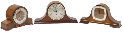 Three teak cased 1950s and later mantel clocks, each with eight day movement, in mahogany and walnut cases.