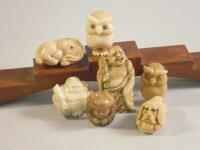 Various simulated ivory okimonos and netsuke.