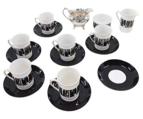 A Troy Windsor pattern coffee service, on a white ground with black border, and gold and blue box design, comprising milk jug, sugar bowl, six coffee cans and saucers, and a silver plated sauce boat.