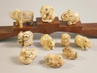 Various modern simulated ivory netsukes and okimonos