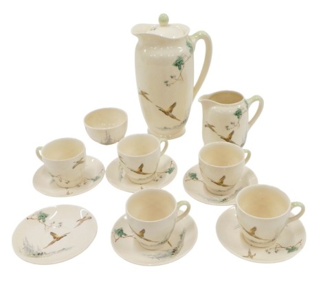 A Royal Doulton Coppice pattern part coffee service, comprising five tea cups and saucers, milk jug, sugar bowl, and coffee pot.