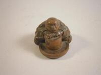 A Japanese carved wooden netsuke
