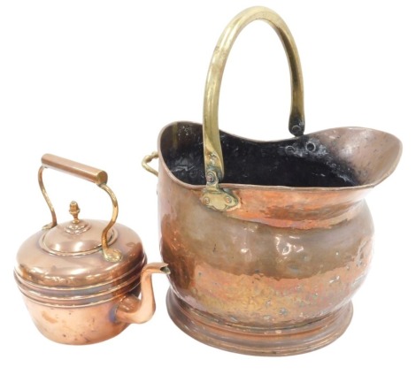 A copper coal scuttle and a copper kettle.