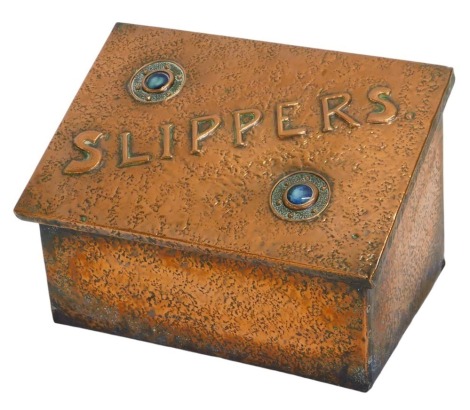 An Art Nouveau copper slippers storage box, with raised circular turquoise motifs, lined interior, 32cm high, 38cm wide, 25cm deep.