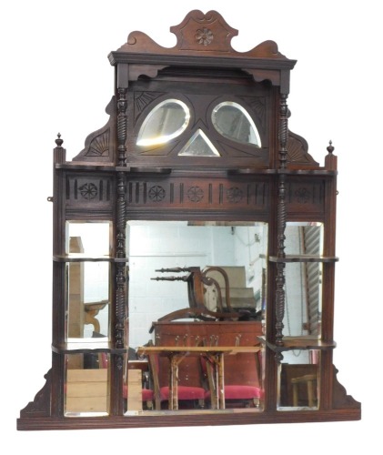 A 20thC mahogany overmantel mirror, with rectangular mirror centre panel, on turned column supports, 128cm high, 88cm wide, 13cm deep.