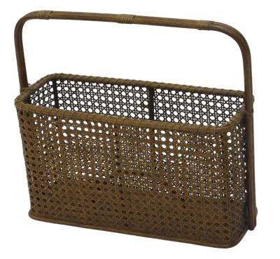 A basket weave magazine rack, of pierced design with arched handle and split central section, 41cm high, 40cm wide, 14cm deep.