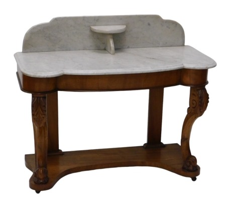 A Victorian Duchess mahogany wash stand, with shaped grey and white marble top with splash back and shelf, plain frieze below, supported on two carved French cabriole legs with scrolling feet, and with shaped pot shelf, 106cm wide, 47cm deep.