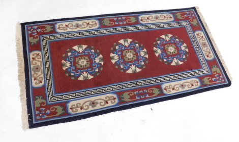 An Oriental Bokhara design rug, 163cm x 114cm.