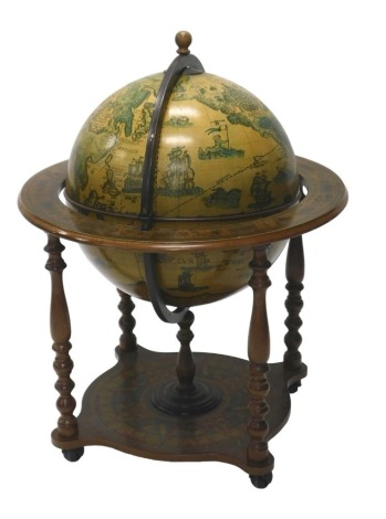 A reproduction terrestrial globe drinks trolley. VAT is payable on the hammer price of this lot