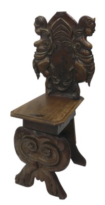 A Portuguese carved walnut hall chair, with carved back and shaped seat, above scrolling claw feet.