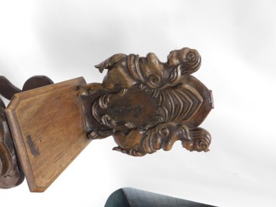 A Portuguese carved walnut hall chair, with carved back and shaped seat, above scrolling claw feet. - 2