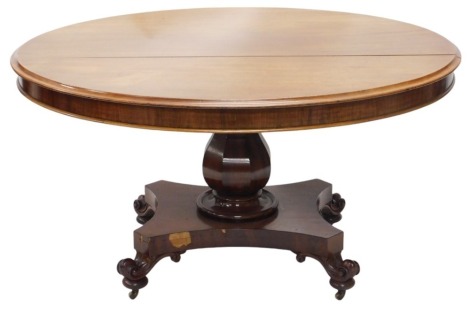 An early Victorian mahogany breakfast table, with oval top, having thumb moulded border and plain frieze, on a octagonal baluster column, with flat quadroform platform and scrolling feet with brass castors, 140cm x 122cm x 77cm.