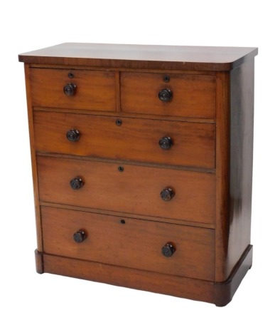 A Victorian figured mahogany chest of drawers, of two short and three long graduated drawers below, with turned knop handles.