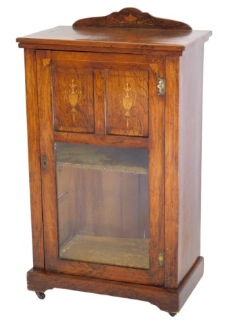 A Victorian rosewood side cabinet, with low gallery back, and enclosed by a single door, with plush lined shelves within, the door partially glazed, with two inlaid panels, on pot castors, 98cm high, 57cm wide, 35cm deep.