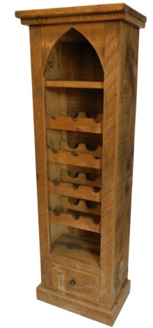 A modern heavy pine wine rack, of plank construction for twelve bottles, and with upper shelf and lower drawer, on plain plinth base, 108cm high, 59cm wide.