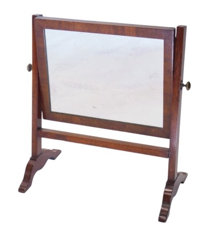 A 19thC mahogany swing framed rectangular toilet mirror, on plain supports and scroll feet, 51cm high.