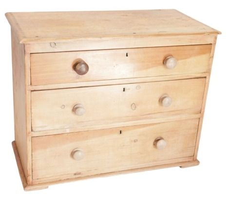 A Victorian pine chest, of three graduated drawers with knop handles, 89cm wide.