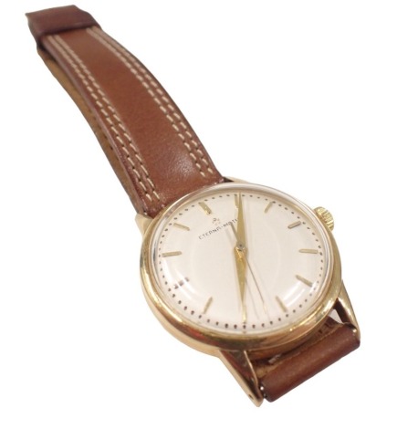 An Eternamatic gent's wristwatch, in yellow metal casing stamped 14kt, with seventeen jewel movement, on later brown leather strap, the dial 3cm diameter, boxed.