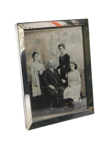 A 20thC white metal photograph frame, of rectangular form, stamped sterling, 21cm x 15cm.