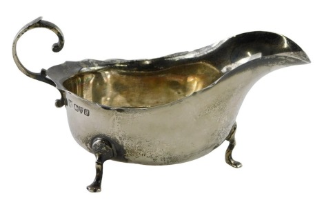 A George V silver sauce boat, with arched handle and fluted borders, Chester 1918, 2.79oz.