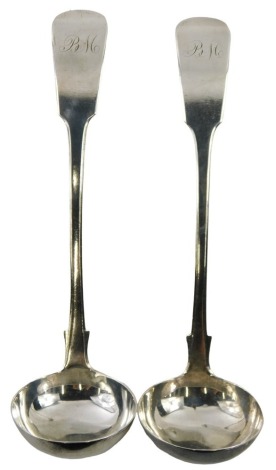 Two George IV Scottish silver fiddle pattern sauce ladles, each bearing the initials BM, maker WR, Glasgow 1826, 2.27oz.