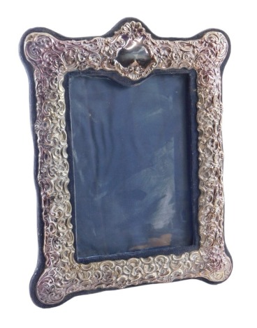 An Elizabeth II white metal framed photograph frame, of rectangular form, on blue velvet backing, 27cm high, 21cm wide.