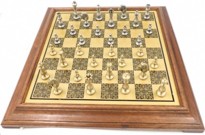 A BCF brass chess set, boxed, and a chess board.